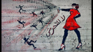 Photo shows graffiti of a woman with the words "no harassment" in Arabic, taken on June 23, 2012. (AP Photo/Maya Alleruzzo)