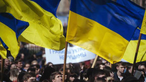 A Ukrainian student waves his national flag during a nationalist and pro-unity rally in the eastern city of Lugansk on April 17, 2014. (AFP PHOTO/DIMITAR DILKOFF)