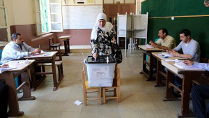 An Egyptian woman casts her ballot during the second day of presidential elections at a polling station in the Heliopolis district of Cairo on May 27, 2014. (EPA/KHALED ELFIQI)