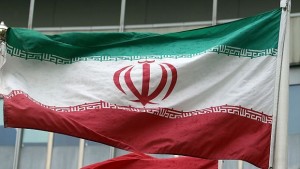 The Iranian flag wave in front of a UN building where closed-door nuclear talks take place at the International Center Vienna, Austria, Thursday, May 15, 2014. The talks between Iran and six world powers have entered an ambitious new stage with the two sides sitting down to start drafting the text of a final deal. (AP Photo/Ronald Zak)