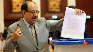A handout picture released by the Prime Minister's Office shows Prime Minister Nuri Al-Maliki casting his ballot during the Iraqi legislative election at a polling station in the green zone in Baghdad, Iraq, on April 30, 2014. (EPA/PRIME MINISTER)