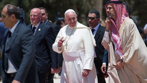 In this photo provided by the Vatican newspaper L'Osservatore Romano, Pope Francis is welcomed upon his arrival in Amman, Jordan, on Saturday, May 24, 2014. (AP Photo/L'Osservatore Romano, ho)