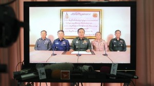 Thai Armed Forces Chiefs are shown on television announcing the military takeover in Bangkok, Thailand, on May 22, 2014. (AP Photo/Apichart Weerawong)