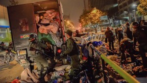 Bolivarian National Guard soldiers load a truck with students belongings as they dismantle student encampments outside UN headquarters in Caracas, Venezuela, on May 8, 2014. (AP Photo/Carlos Becerra)
