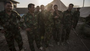 Kurdish Peshmerga soldiers preparing for deployment in the battle against the militant Islamic State of Iraq and Syria in mid-June 2014. (Asharq Al-Awsat/Hannah Lucinda Smith)