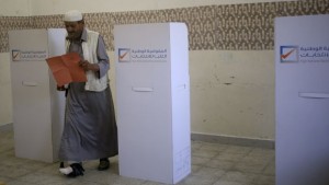 A man leaves a voting booth during a parliamentary election in Benghazi, Libya, on June 25, 2014. (REUTERS/Esam Omran Al-Fetori)