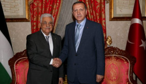 A handout picture provided by the Turkish Prime Minister's Press Office shows Palestinian President Mahmoud Abbas (L) and Turkish Prime Minister Recep Tayyip Erdogan during their meeting in Istanbul, Turkey, on July 18, 2014. (EPA/TURKISH PRIME MINISTER PRESS OFFICE)