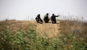 Israeli soldiers patrol near the border with Gaza on July 23, 2014.(REUTERS/Amir Cohen)