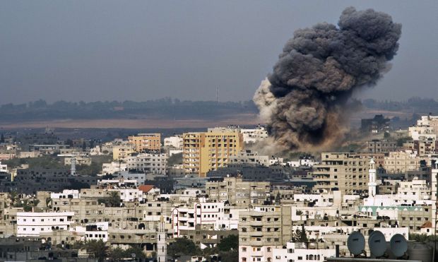 Gunmen execute 18 alleged collaborators in Gaza; Israel launches air strikes