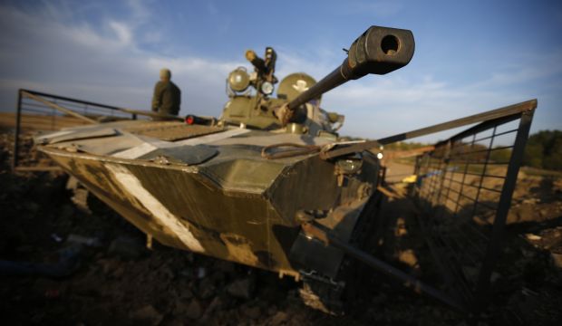 Ukrainians to pull back big guns from front line with separatists