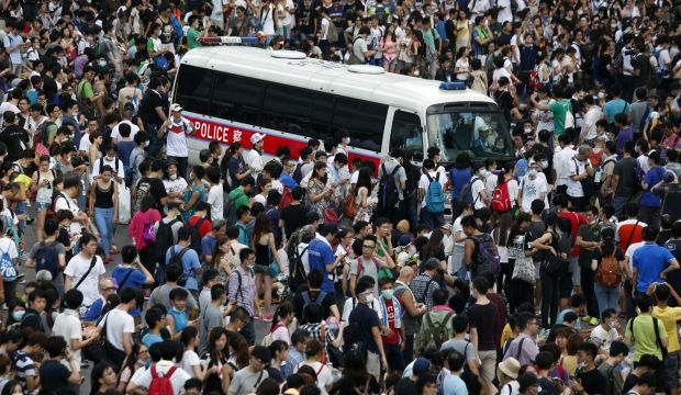 Hong Kong police barricade streets, block in protesters