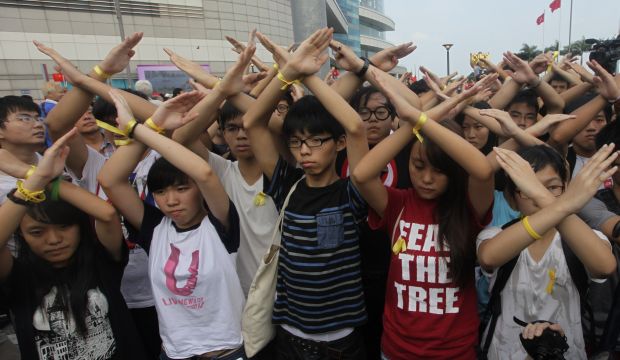 Hong Kong democracy protesters and officials mark uneasy National Day