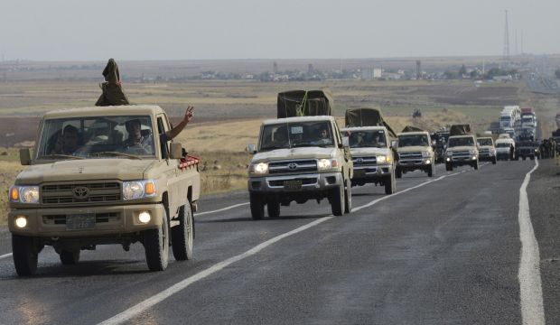 Air strikes hit Kobani as Kurdish Peshmerga prepare to enter