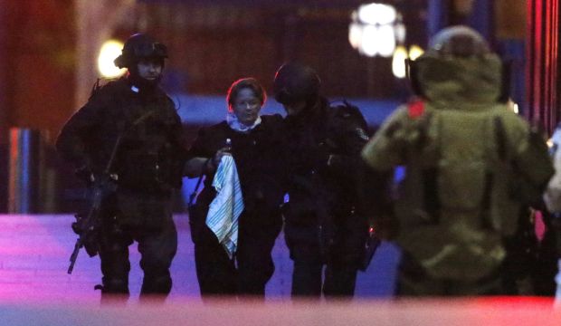Police storm Sydney cafe to end hostage siege, reports say 3 dead