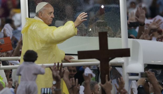Pope says Mass for huge Manila crowd, appeals for suffering children