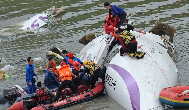 Taiwan plane cartwheels into river after take-off, killing at least 16