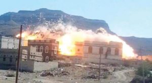 A house set ablaze by Houthi militias