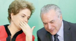 Brazilian President Dilma Rousseff talking to the Vice President Michel Temer, who will take over the rule next month
