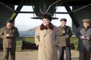 North Korea leader Kim Jong Un smiles as he visits Sohae Space Center for the testing of a new engine for an ICBM