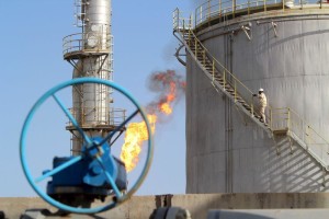A worker climbs stairs at the Halfaya oilfield in Amara, southeast of Baghdad