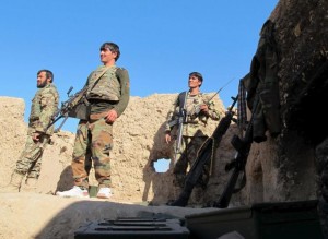 ANA soldiers stand at an outpost in Helmand province