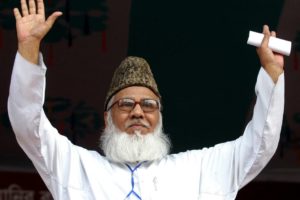 Matiur Rahman Nizami waves at students at a rally in Dhaka.