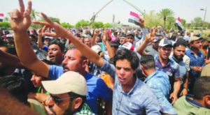 Iraqis protest before the Parliament in the Green Zone in Baghdad