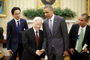 U.S. President Barack Obama (2nd R) shakes hands with Vietnam's Communist Party General Secretary Nguyen Phu Trong after they spoke to reporters following their meeting in the Oval Office at the White House in Washington July 7, 2015. REUTERS/Jonathan Ernst/File Photo