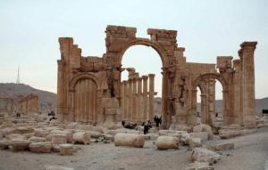 Tourists walk in the historical city of Palmyra