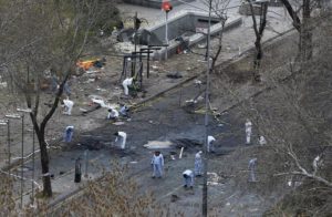 Forensic officers work on the site of a suicide bomb attack in Ankara
