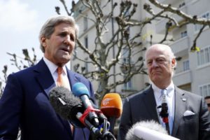 US Secretary of State Kerry gestures next to UN Special Envoy on Syria de Mistura during a news conference in Geneva