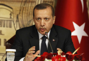 Turkish President Recep Tayyip Erdogan gestures during a news conference.