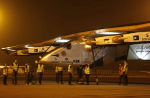 Ground staff prepare to push the "Solar Impulse 2", a solar powered plane, into a hangar after it landed at the airport in the western Indian city of Ahmedabad March 11, 2015. REUTERS