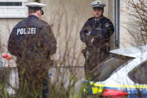 Police guard a house on March 25, 2016 in Düsseldorf, where a man suspected of being linked to terror attacks in Brussels was arrested the previous day.