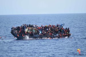 This picture released on May 25 by the Italian navy shows the shipwreck of an overcrowded boat of migrants off the Libyan coast.