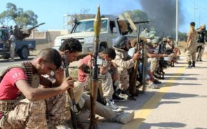 Libyan soldiers rest during assault on Sirte .REUTERS