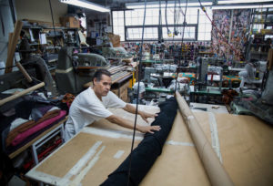 A worker rolls a sheet of leather at Justin Paul, a handbag manufacturer in Brooklyn. Brexit has reinforced the dollar as the foundation of global finance, but a stronger dollar hurts exports.