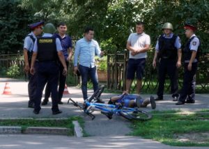 Police officers detain a man after an attack in the centre of Almaty, Kazakhstan, July 18, 2016. REUTERS/Shamil Zhumatov