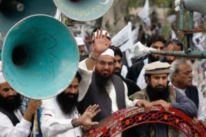 Hafiz Saeed (C), head of the Jamaat-ud-Dawa organisation and founder of Lashkar-e-Taiba, waves to his supporters as he leads the rally to mark Pakistan Day (Resolution Day) in Islamabad March 23, 2014. (Mohsin Raza/Reuters)