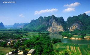 File photo provided by the UNESCO official website shows a view of Huashan Rock Art Cultural Landscape along the Zuojiang River in south China's Guangxi Zhuang Autonomous Region