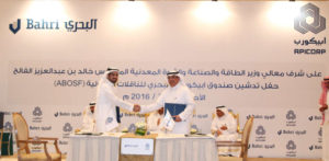 Dr. Aabed Bin Abdulla Al Saadoun, Chairman of APICORP shakes hands with Abdulrahman Mohammed Al Mofadhi, Chairman of Bahri