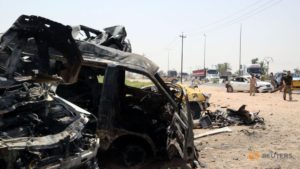 Destroyed vehicles are seen at the site of a suicide car bomber in Khalis, north of Baghdad, Iraq, July 25, 2016. Reuters/Stringer