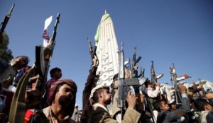 Followers of the Houthi group raise their weapons as they demonstrate against an arms embargo imposed by the U.N. Security Council on the group in Sanaa