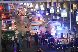 Paramedics help casualties outside Turkey's largest airport, Istanbul Ataturk, Turkey, following a blast