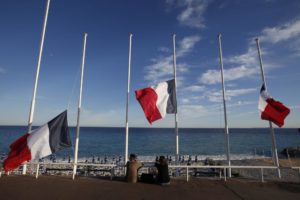 Flags fly at half-mast in memory of victims the day after a truck ran into a crowd at high speed killing scores and injuring more who were celebrating the Bastille Day national holiday, in Nice. REUTERS/Eric Gaillard