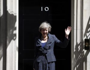 Britain's Home Secretary Theresa May, who is due to take over as prime minister on Wednesday, waves as she leaves after a cabinet meeting at number 10 Downing Street, in central London, Britain July 12, 2016. REUTERS/Peter Nicholls