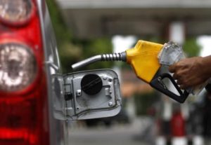 A worker fills a tank with subsidized fuel at a fuel station in Jakarta April 18, 2013. REUTERS/Beawiharta