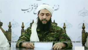 Mohammed al-Jolani of Jabhat al-Nusra reading a prepared statement announcing Nusra's official split from Al Qaeda on Thursday.Orient News via Youtube