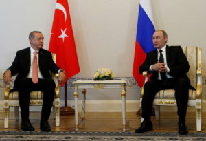 Russian President Vladimir Putin (R) speaks to Turkish President Tayyip Erdogan during their meeting in St. Petersburg, Russia, August 9, 2016. REUTERS/Sergei Karpukhin - RTSM1UY
