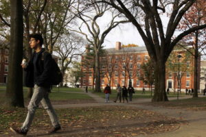 A man walks through Harvard Yard at Harvard University in Cambridge, Massachusetts November 16, 2012. REUTERS/JESSICA RINALDI